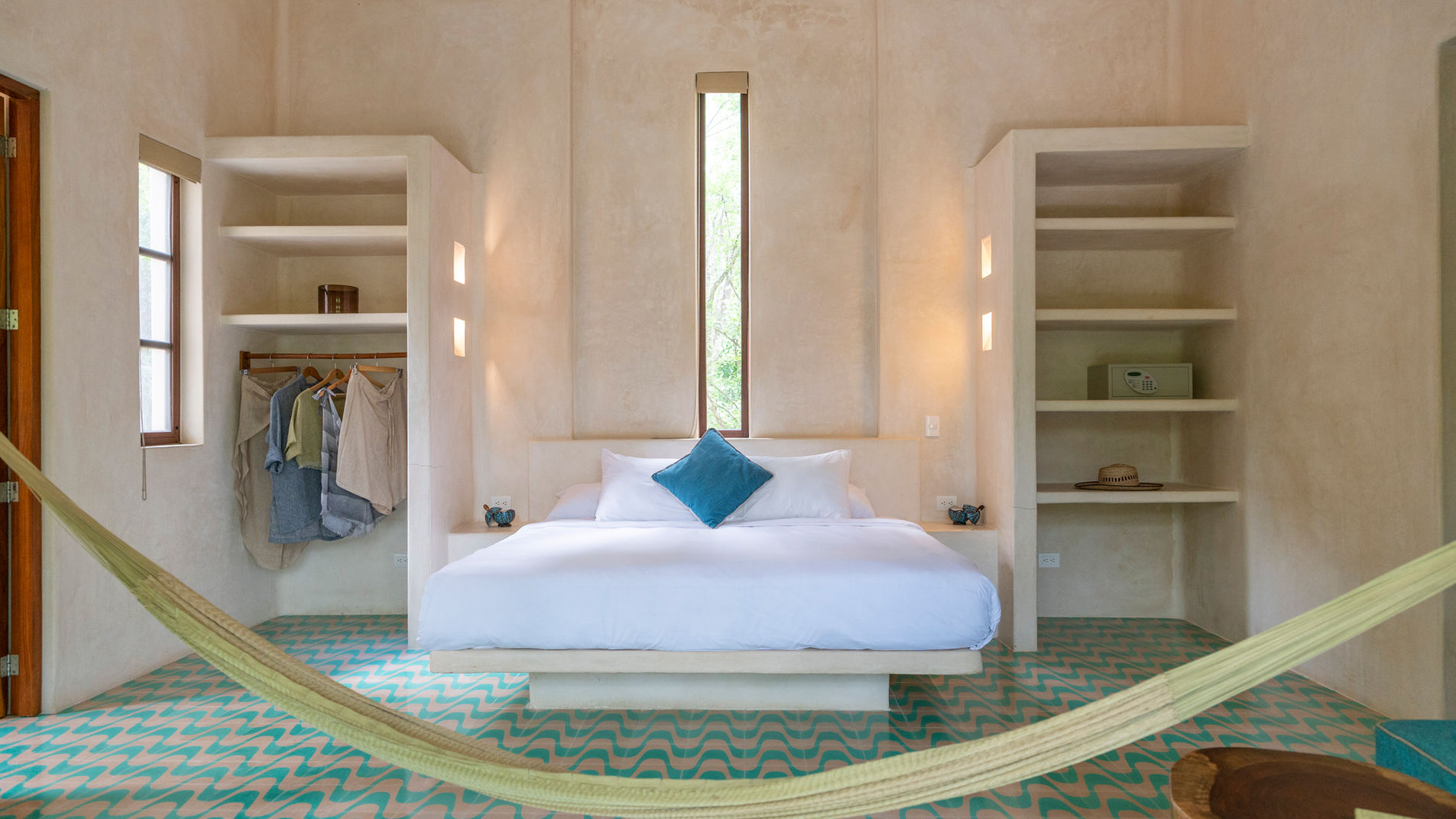 Single room with private balcony overlooking the pool and jungle
